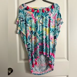 Beach cover-up with hot pink, tassels, and Low V cut in the back